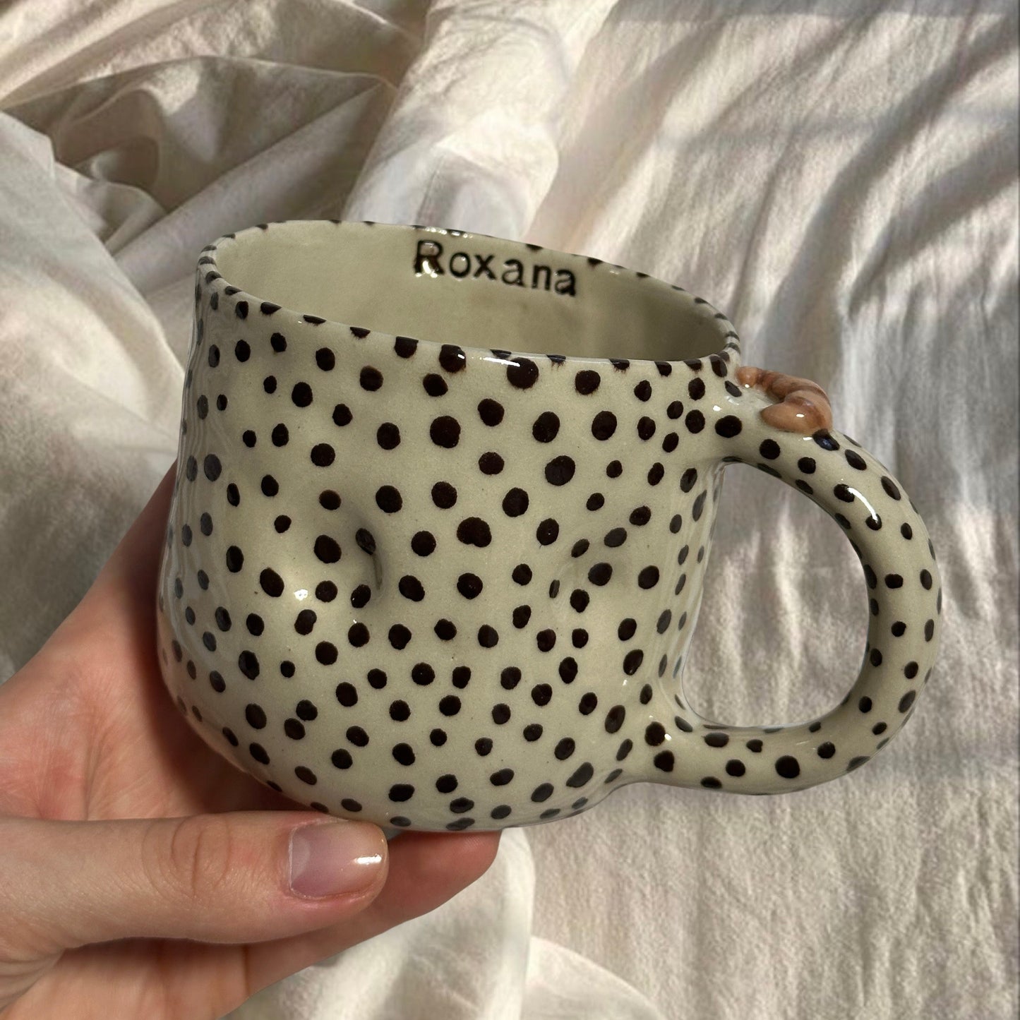 Handmade chunky dotted mug with croissant