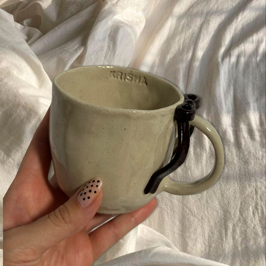 Handmade dark brown bow mug
